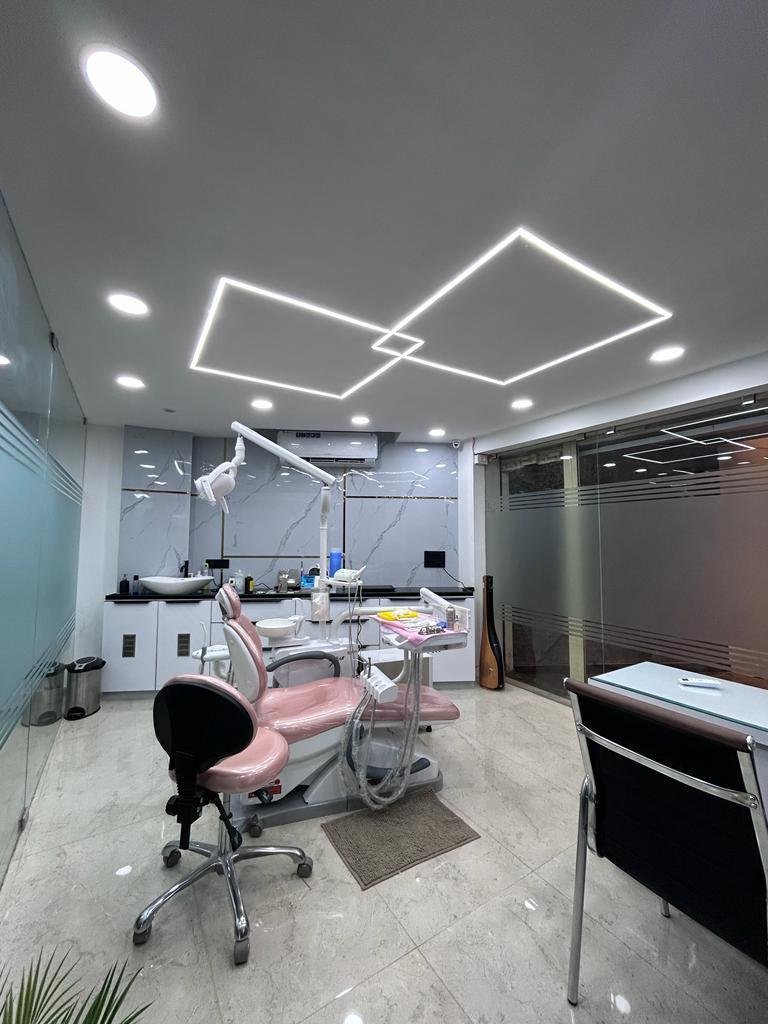 Treatment chair under a geometric ceiling light